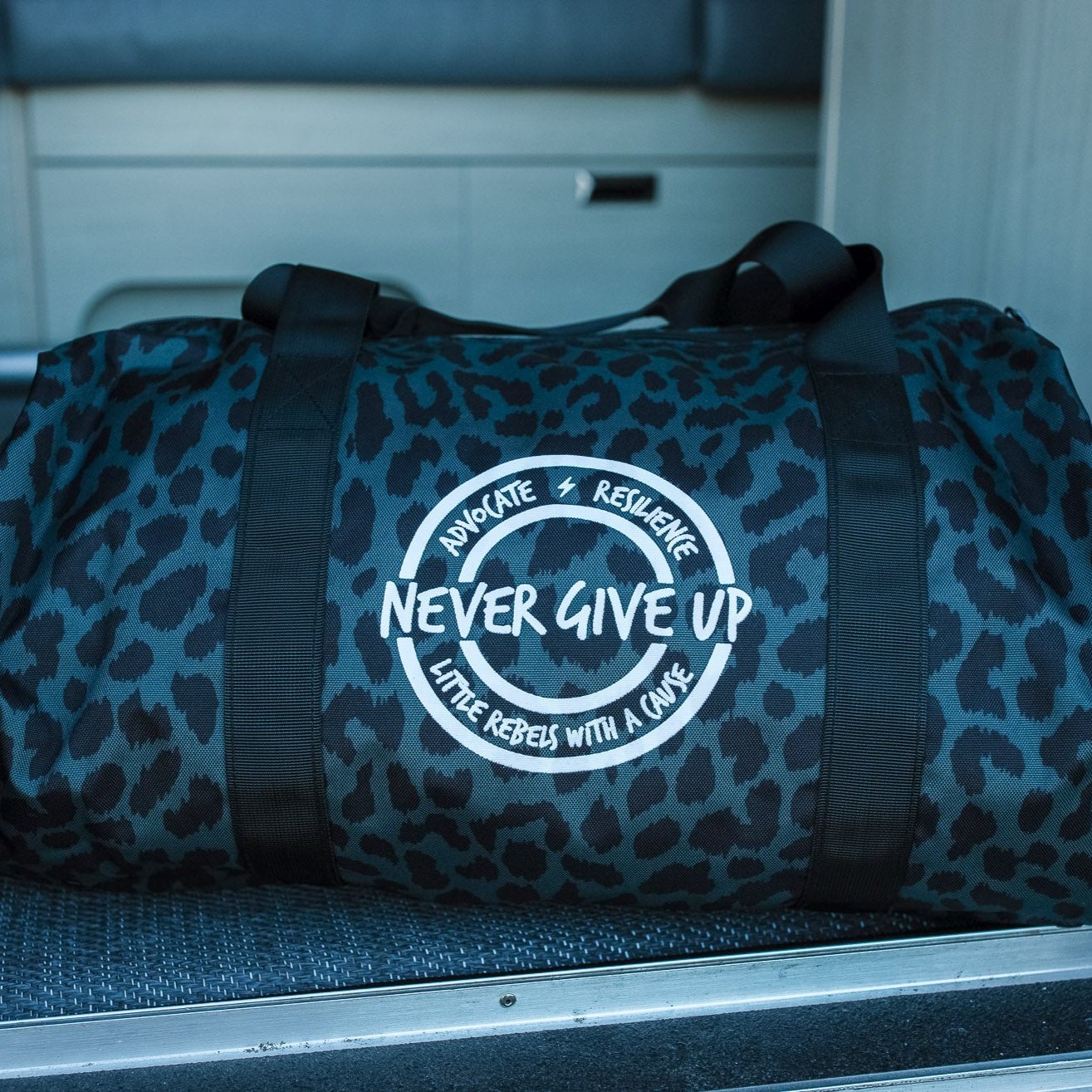 Advocate. Resilience. Never Give Up. Duffle Bags – Rebel Clothing ...